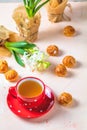 Red in white dotted cup of tea, profiteroles and hyacinths Royalty Free Stock Photo