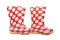 Red and white dotted kids rain boots on a white background