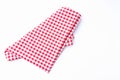 Red and white fabric tablecloth checkered on white background. Royalty Free Stock Photo