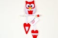 Red and white felt owl on wood branch, 2 hearts, handmade toys