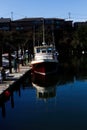 Red And White Fishing Boat Tied To Dock Royalty Free Stock Photo