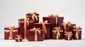 Red and white gift wrapped presents with red and gold ribbon bows, isolated on white background Royalty Free Stock Photo