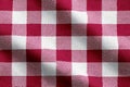 Red and white gingham fabric creating a classic checkered pattern background Royalty Free Stock Photo