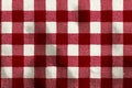 Red and white gingham fabric creating a classic checkered pattern and textile background Royalty Free Stock Photo