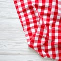 Red and White Gingham Fabric Draped on White Wooden Planks checkered Royalty Free Stock Photo