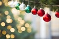 Red, white and gold Christmas baubles hanging on tree Royalty Free Stock Photo