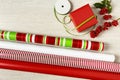 Simple, modern red and green Christmas gift wrapping paper and ribbon with natural decorations