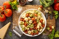 Red, white and green tortellini with vegetables and cheese