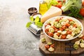 Red, white and green tortellini with vegetables and cheese