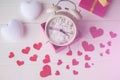 Red and white hearts on wooden background. Retro clock in the box. Saint Valentine`s day concept. Love and romantic photo. Royalty Free Stock Photo