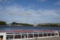 Red and white hull of tourist ferry moored in Binnenalster near city center of Hamburg.