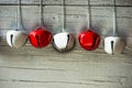Red and white jingle bells in line on silver background Royalty Free Stock Photo