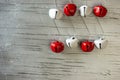 Red and white jingle bells on silver Royalty Free Stock Photo