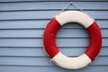 Red and White Lifebuoy on a Blue Background