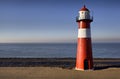 Red-white lighthouse on the coast of North Sea at Westkapelle Royalty Free Stock Photo