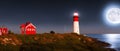 Red with white Lighthouse on sea shore at night in summer. Landscape view Royalty Free Stock Photo