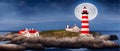 Red with white Lighthouse on sea shore at night in summer. Landscape view Royalty Free Stock Photo