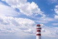 Red White lighthouse with sky and clouds Royalty Free Stock Photo