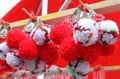 Red and white martenitsi on outdoor market for martenici on the street. Martenitsa or martenitza is given on 1st March as a symbol