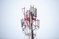 Red-white metal cell tower under the snow Royalty Free Stock Photo