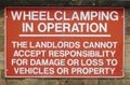 Wheel clamping in operation sign