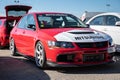 Red white Mitsubishi Lancer Evolution IX parked at an exhibition Royalty Free Stock Photo