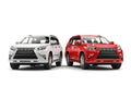 Red and white modern SUVs - side by side Royalty Free Stock Photo