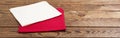 Red and white napkin on wooden table background - mock up, copy space Royalty Free Stock Photo