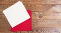 Red and white napkin on wooden table background - mock up, copy space Royalty Free Stock Photo