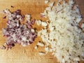 Red and white onions on wooden cutting board Royalty Free Stock Photo