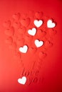 Red and white paper background, cut out hearts are lined up in the shape of a balloon. Words I love you. Set of 4 photos. Royalty Free Stock Photo