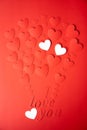 Red and white paper background, cut out hearts are lined up in the shape of a balloon. Words I love you. Set of 4 photos. Royalty Free Stock Photo