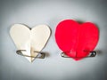 Red and white Paper hearts and safety pin on white background Royalty Free Stock Photo