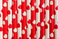 Red and white paper straws eco-friendly background with hearts