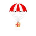 Red and white parachute with gift box on white background