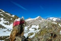 Red white path mark on a rock with view on Hoher Sonnblick in the Hohe Tauern Alps in Carinthia, Austria, Europe. Rock formations