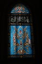 Blue stained glass window in a religious building in Jerusalem