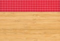 Red white plaid napkin on bamboo wooden floor table or cutting board Royalty Free Stock Photo