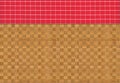 Red white plaid napkin on bamboo wooden floor table or cutting board Royalty Free Stock Photo