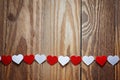 Red and White Ppaper hearts on the clothesline On wood backgrou