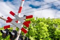 Red and white railroad crossing sign with warning lights Royalty Free Stock Photo