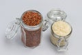 Red and white rice in glass jars