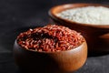 Red and white rice in a wooden bowls Royalty Free Stock Photo