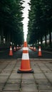 Red and white road cones on footpath, safety concept photo