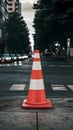 Red and white road cones on footpath, safety concept photo