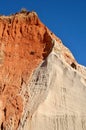 Red/white rock formations on the Falesia beach in Albufeira - Portugal Royalty Free Stock Photo