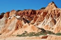 Red/white rock formations on the Falesia beach in Albufeira - Portugal Royalty Free Stock Photo