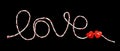 Red and white rope lettering LOVE with two hearts for Valentine`s Day isolated