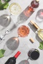 Red, white and rose wine in wine glasses on concrete background. Top view. Beverage and wine concept Royalty Free Stock Photo