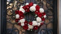 Red and White Rose Wreath on a Black Wrought Iron Door Royalty Free Stock Photo